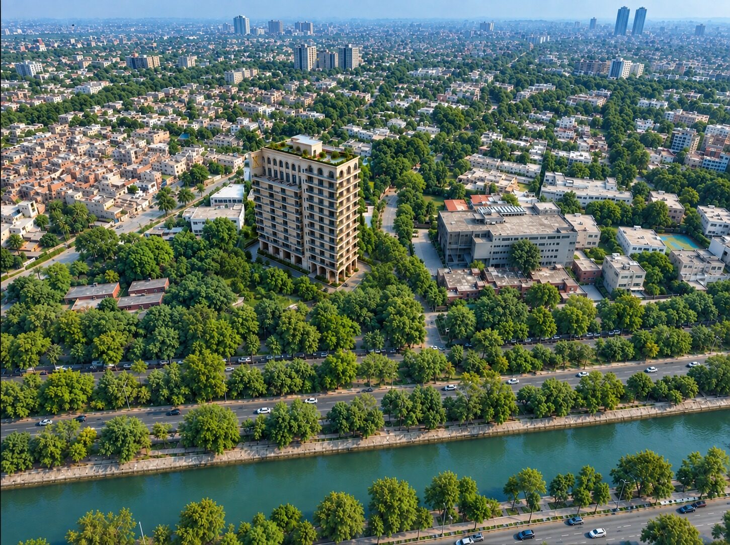 Aerial view of X tower rising above the tree canopy of Gulberg IV, beside the canal